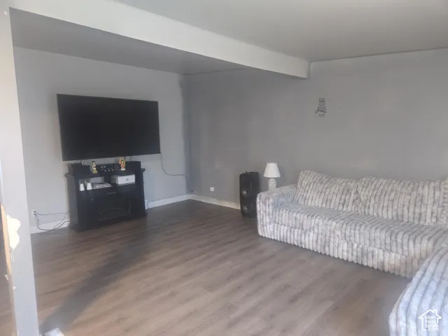 Living area featuring wood-finish flooring and a neutral color palette