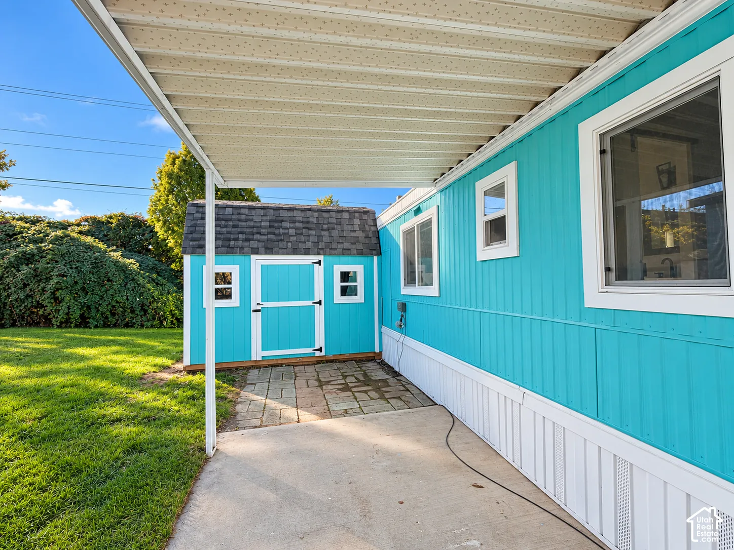 View from front porch, lots of patio between porch and shed