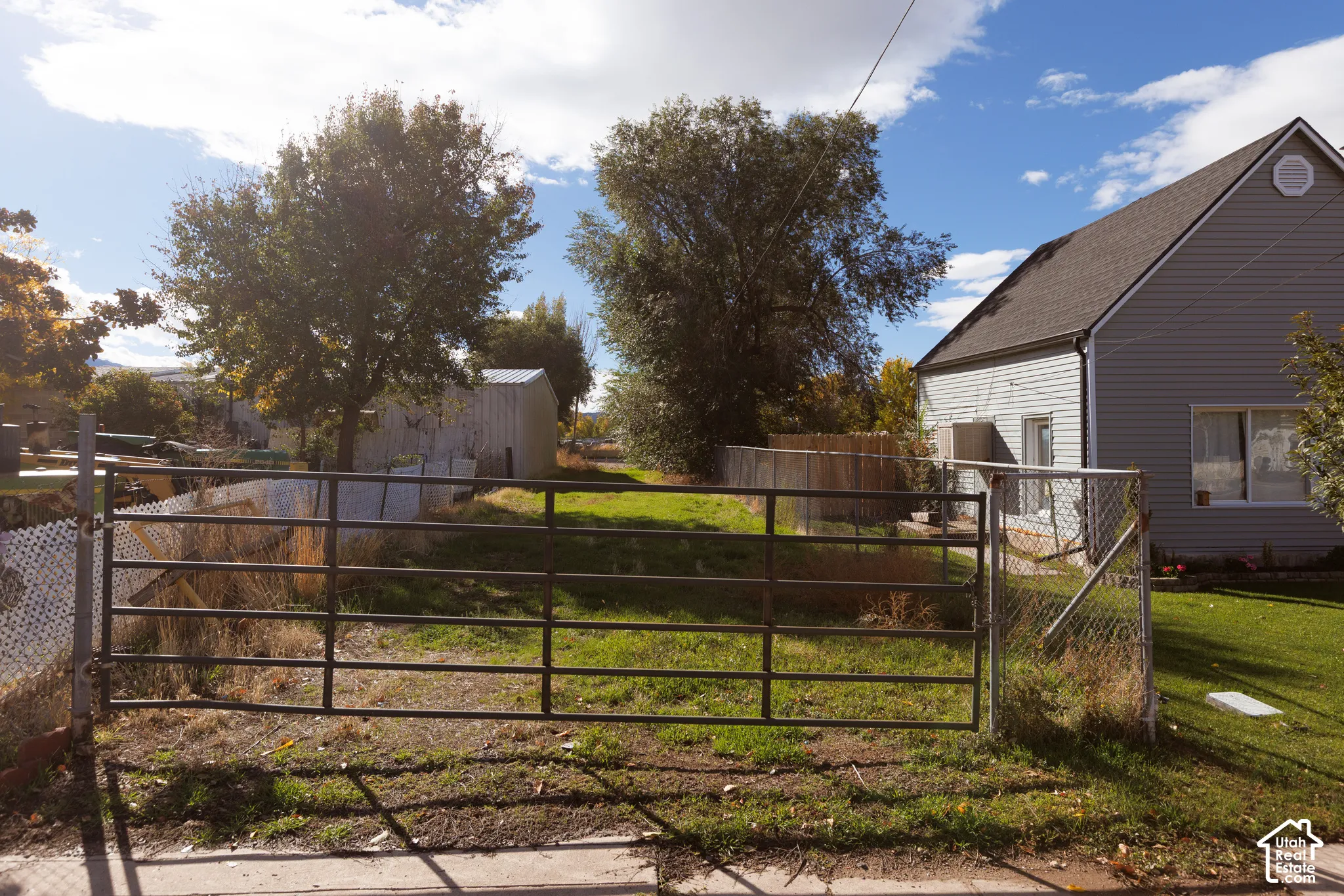 Gated secondary entrance to property from street