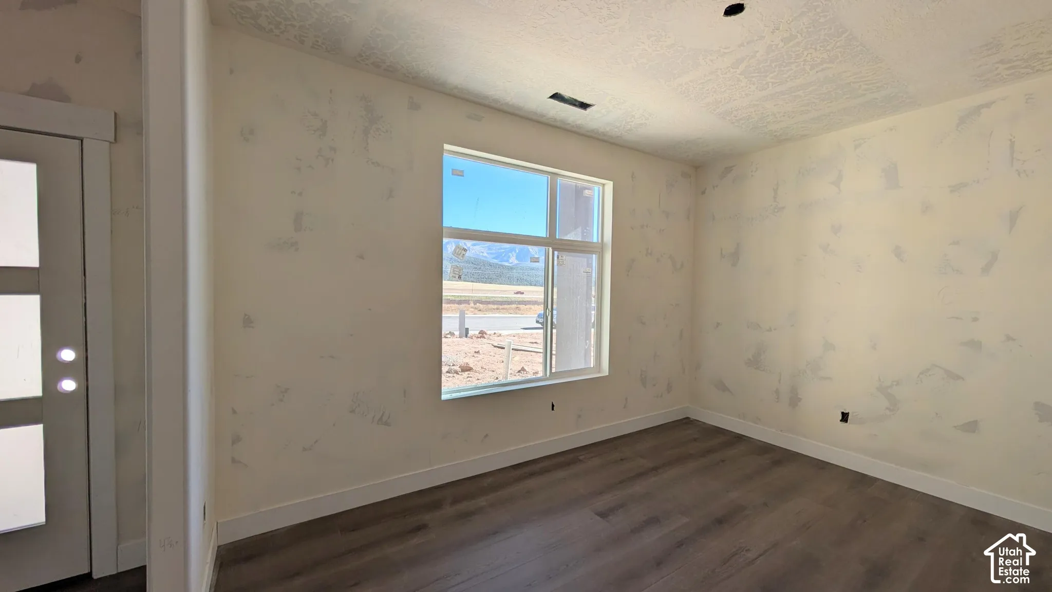 Front Room - large window, double door opening, and closet
