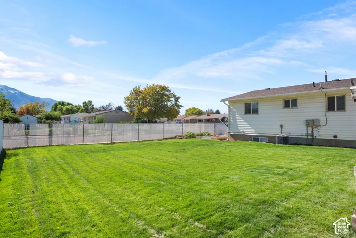 Large fully fenced yard with gate.