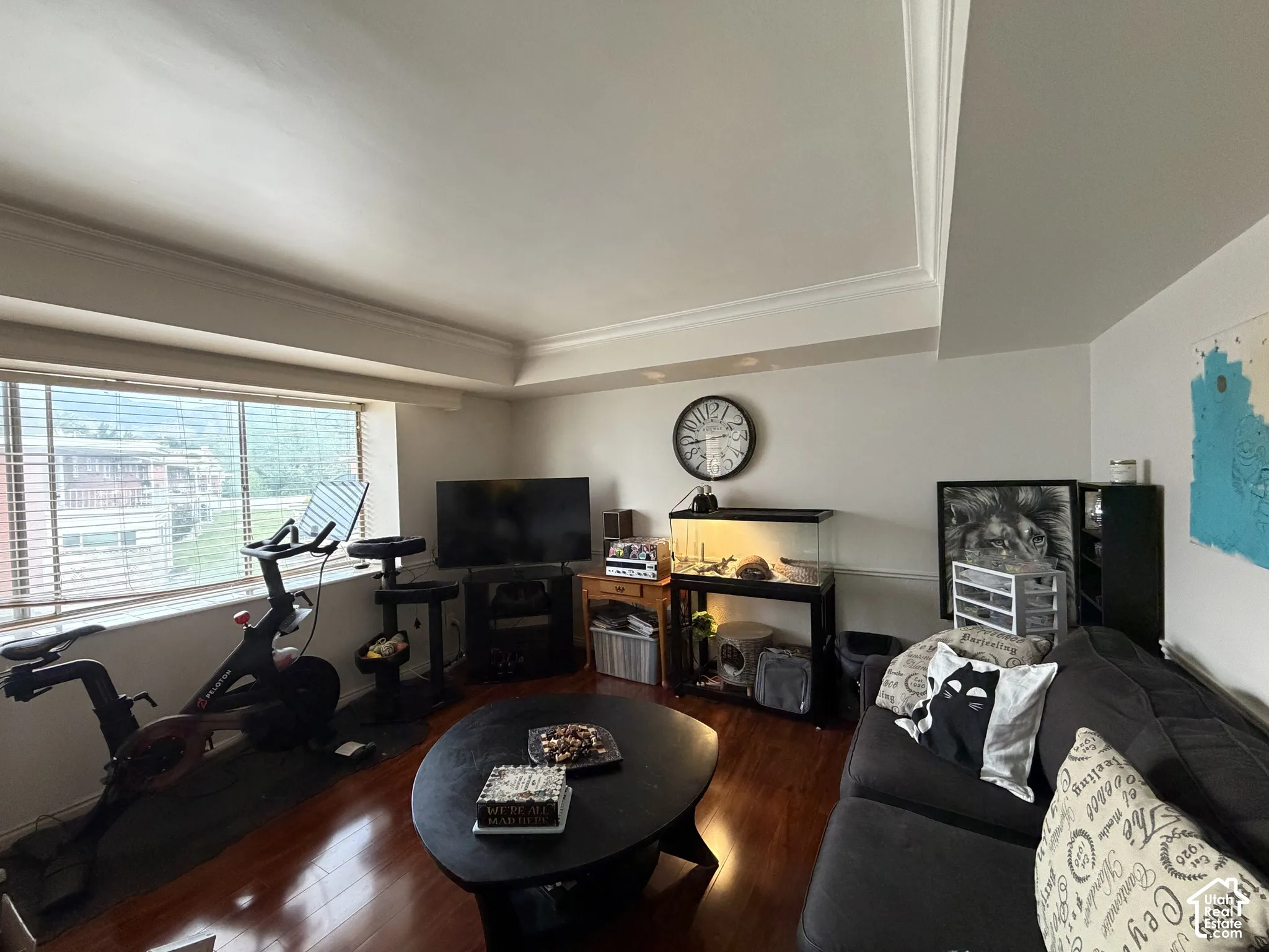 Living space featuring laminate flooring, recessed ceiling detailing, and a large picture window w/Mountain View!