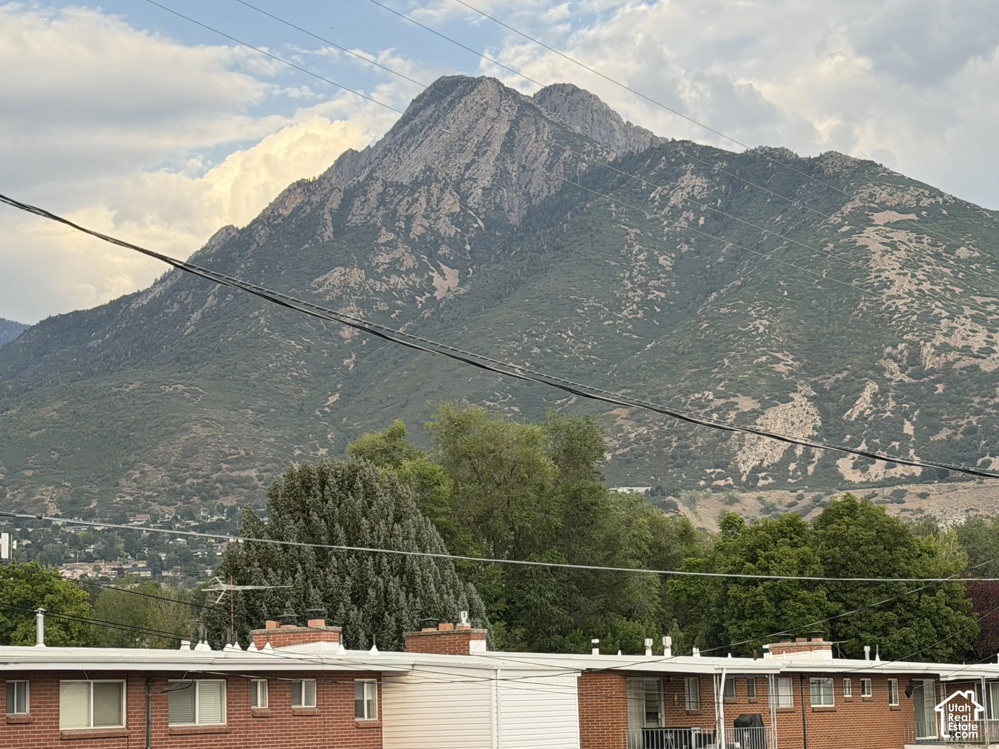 Prominent mountain backdrop view from large living room picture window!