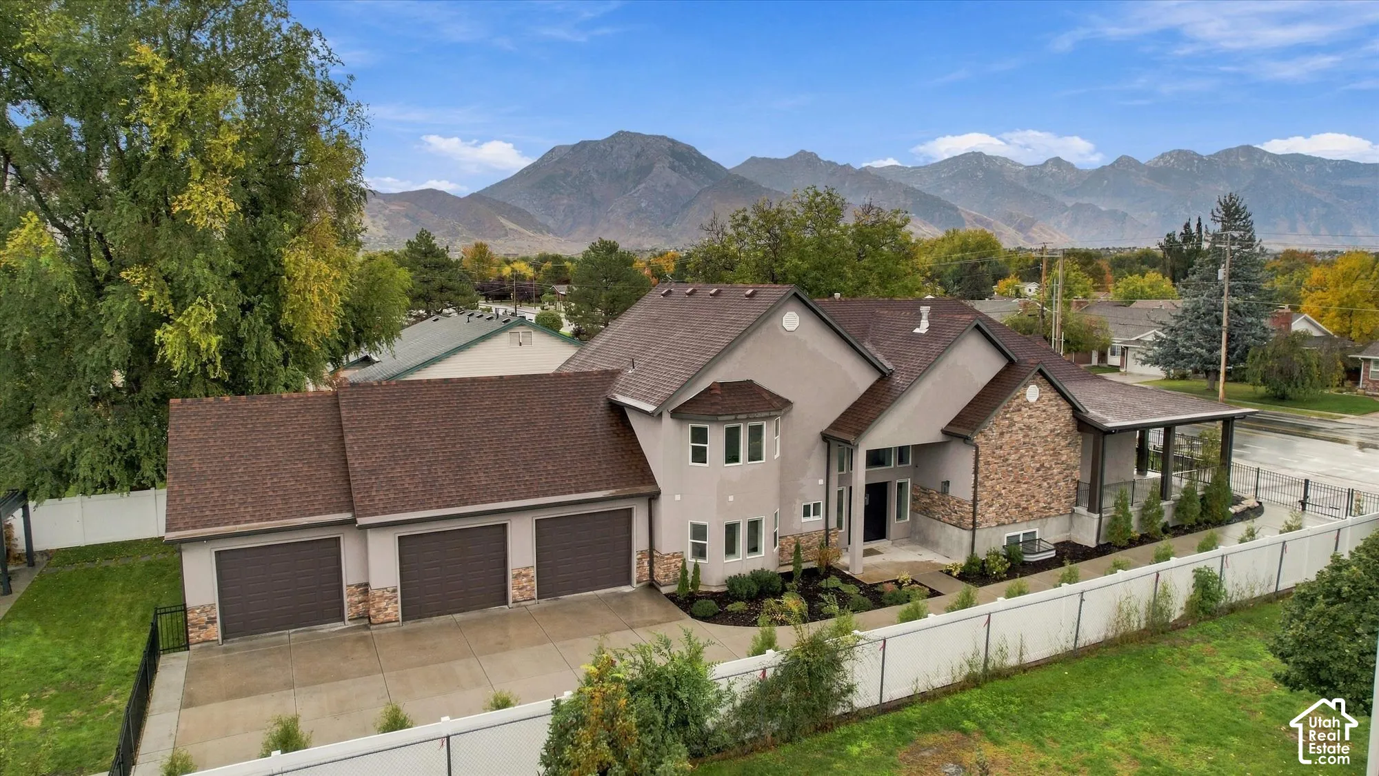 Multi-level exterior featuring a stone and stucco fa
