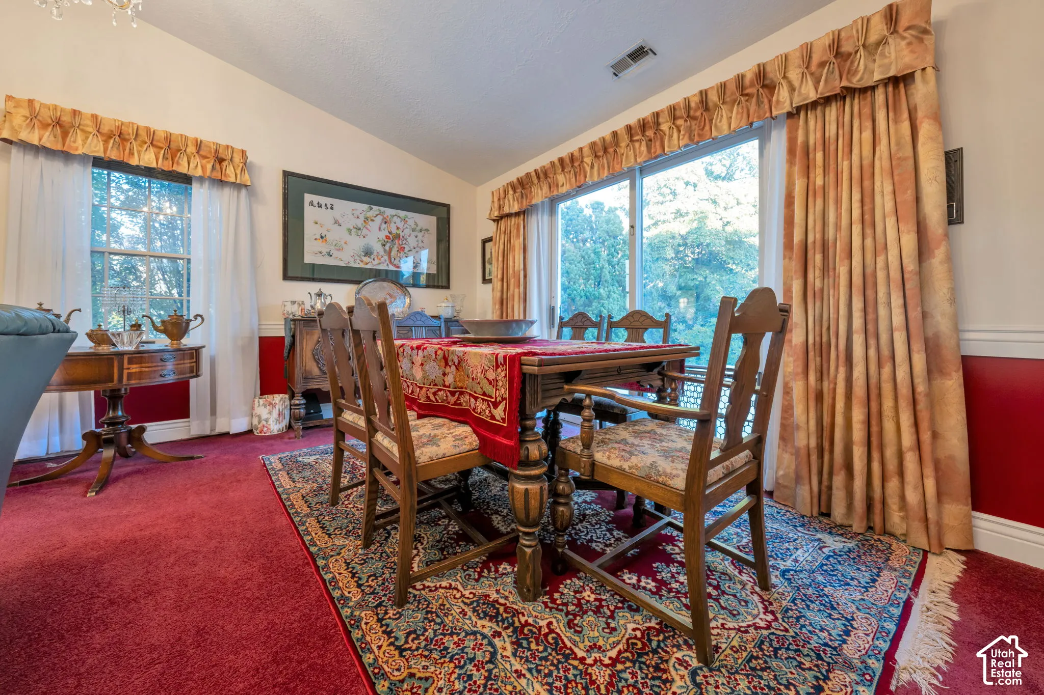 Game table fits comfortable in the upstairs family room. Vaulted ceilings, sliding glass door, and large windows with horizontal chair rail molding