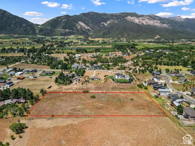 Aerial view of property's location with rural landscape and nearby suburban area
