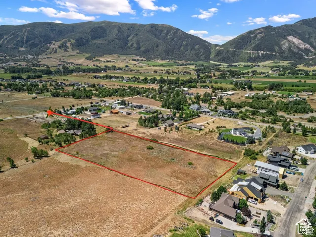 Aerial overview of property's location with rural landscape.Red pin is the access road to the property