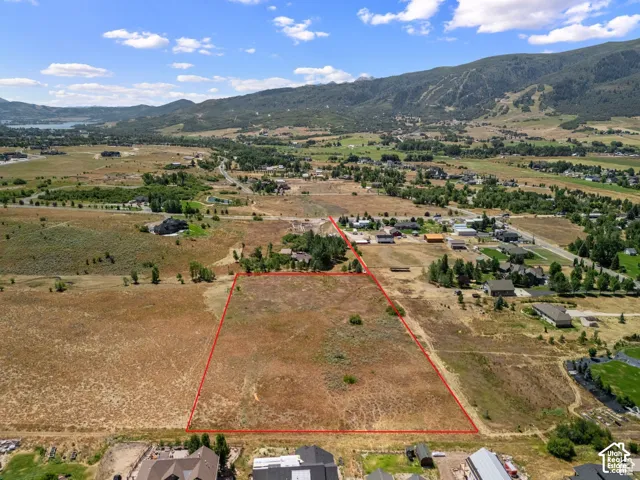 Aerial view of property's location featuring mountains and rural landscape