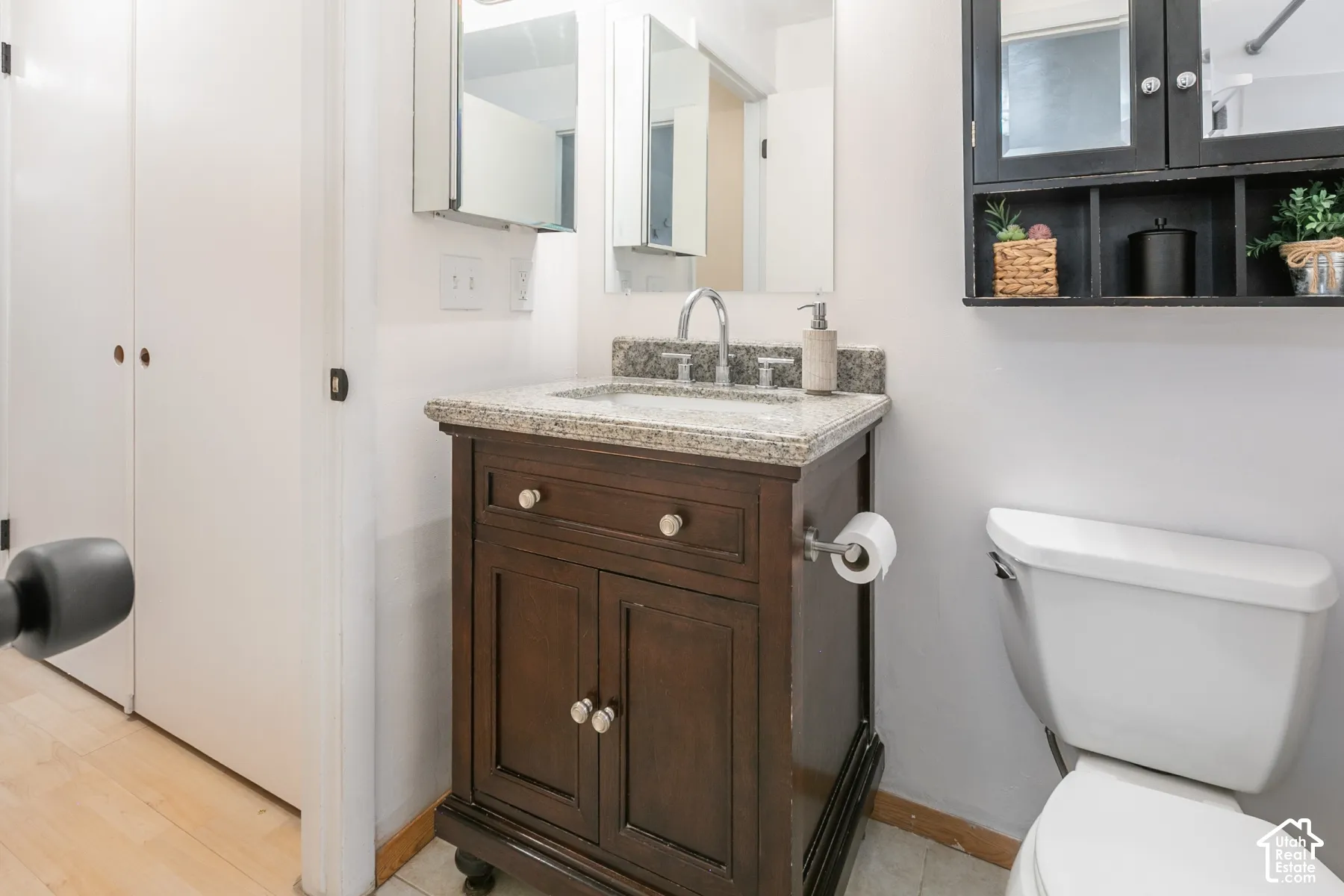 Bathroom on the main floor accessible by Primary bedroom and hall.