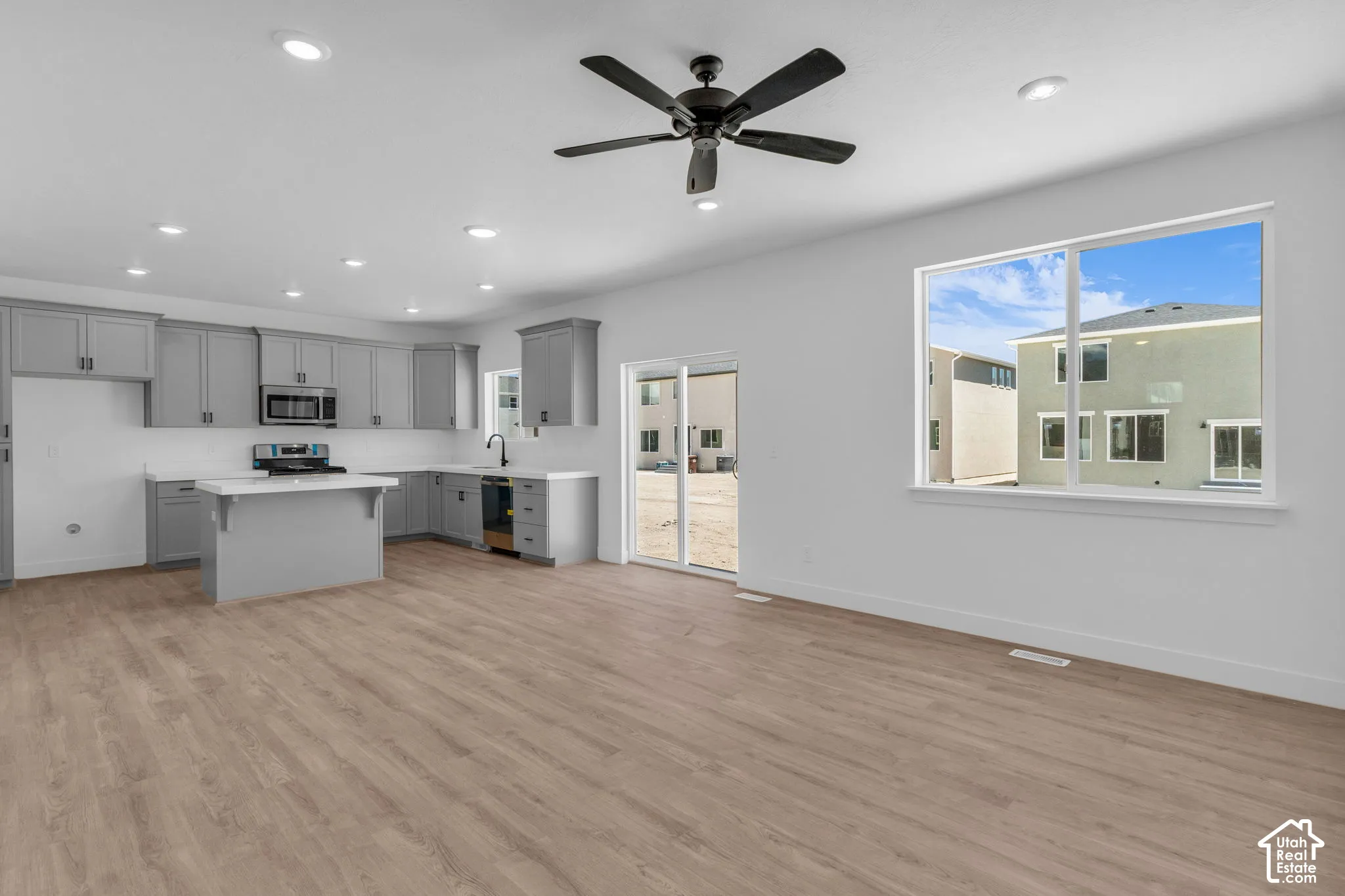 Open dining area adjacent to kitchen and sliding glass door.