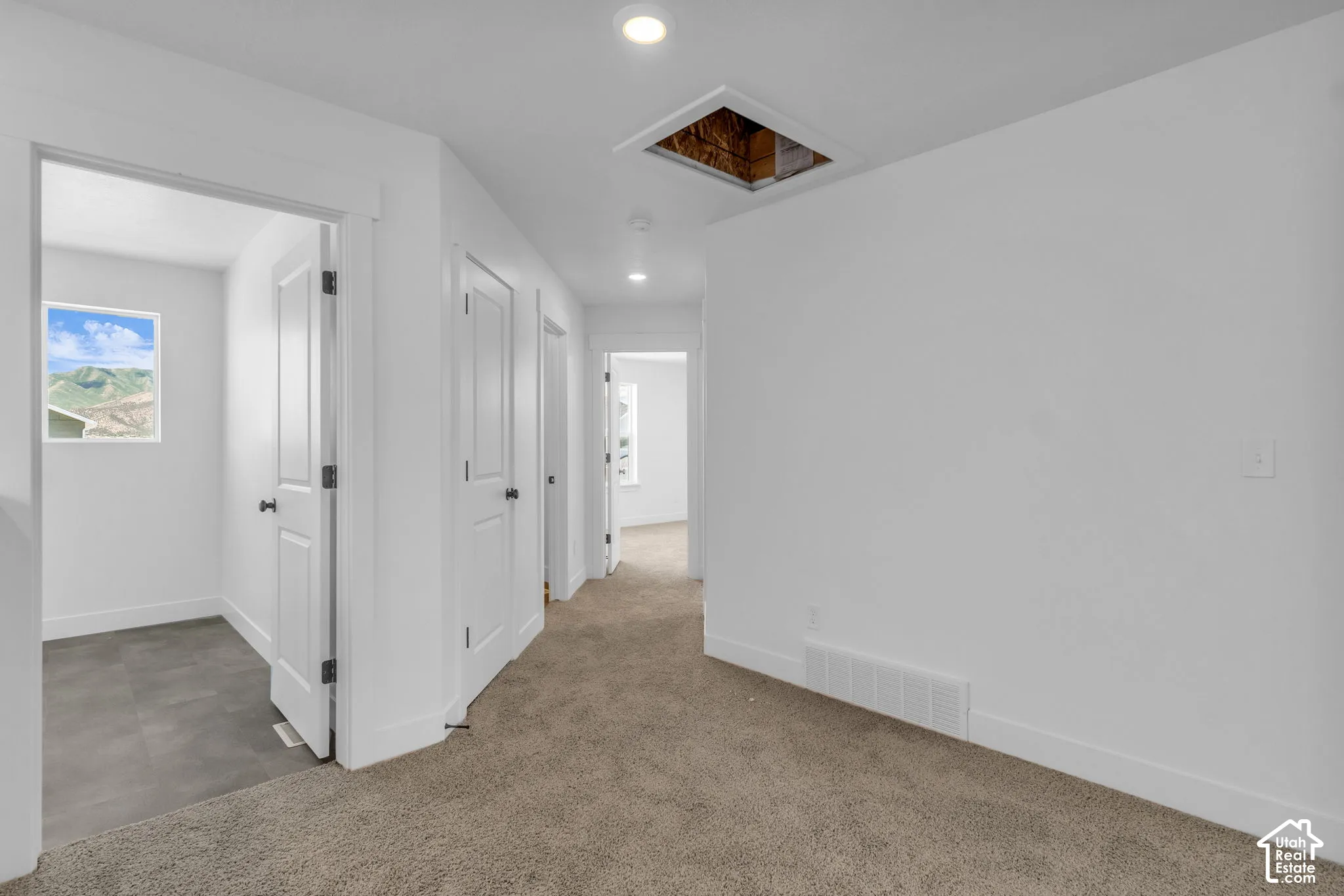 Hallway and open area at top of stairs.