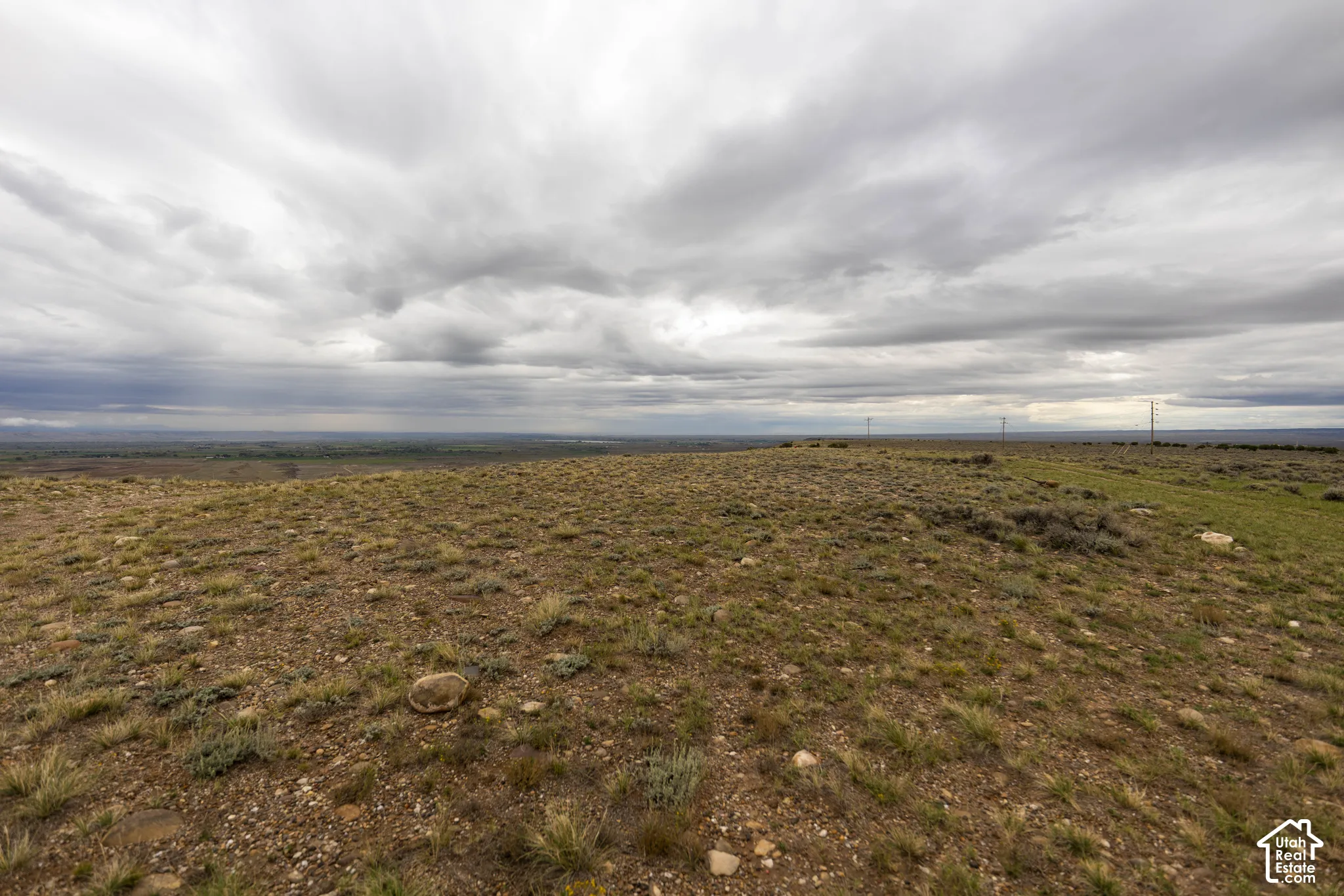 Expansive acreage featuring native desert vegetation, natural rocky terrain, and unobstructed horizon lines