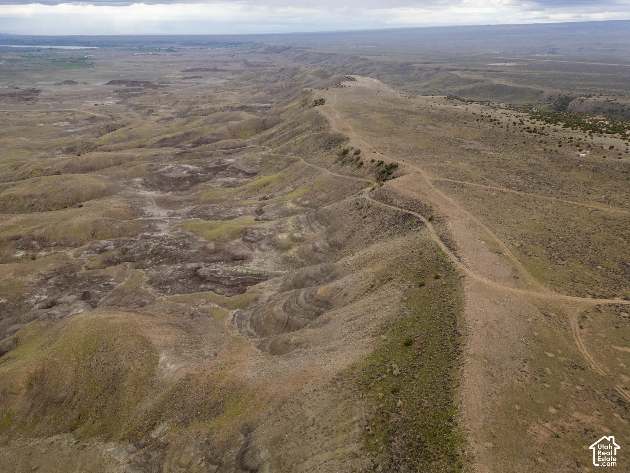 Expansive acreage featuring rugged desert topography, elevated ridgelines, natural rock formations, and native scrub vegetation