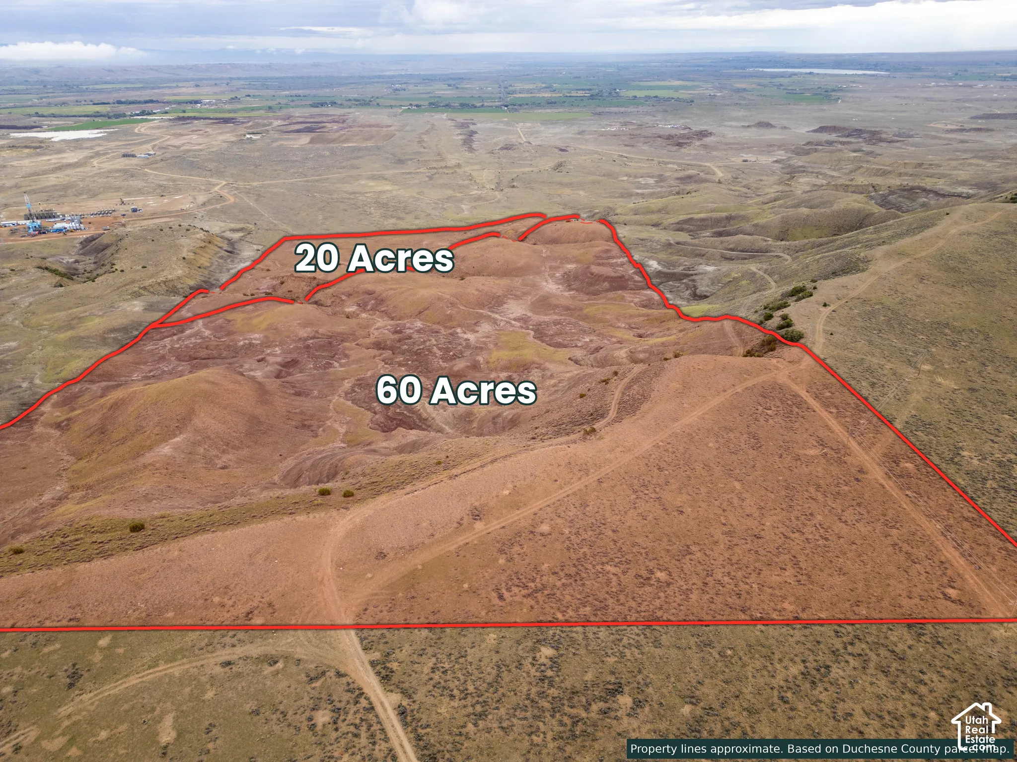 Aerial perspective of 80 acres of undeveloped land featuring expansive terrain and native vegetation