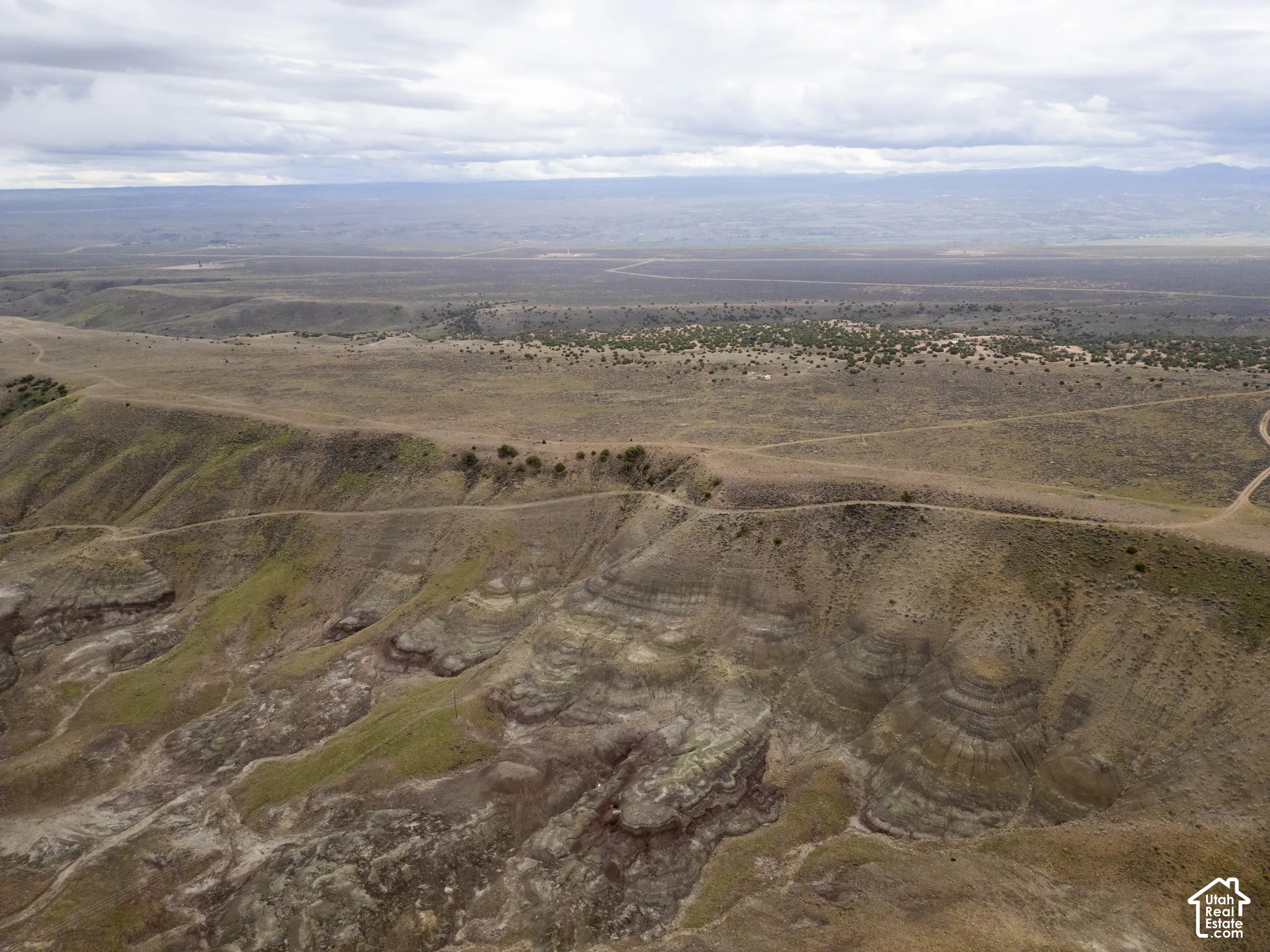 Expansive acreage featuring elevated topography, natural rock formations, and native desert terrain