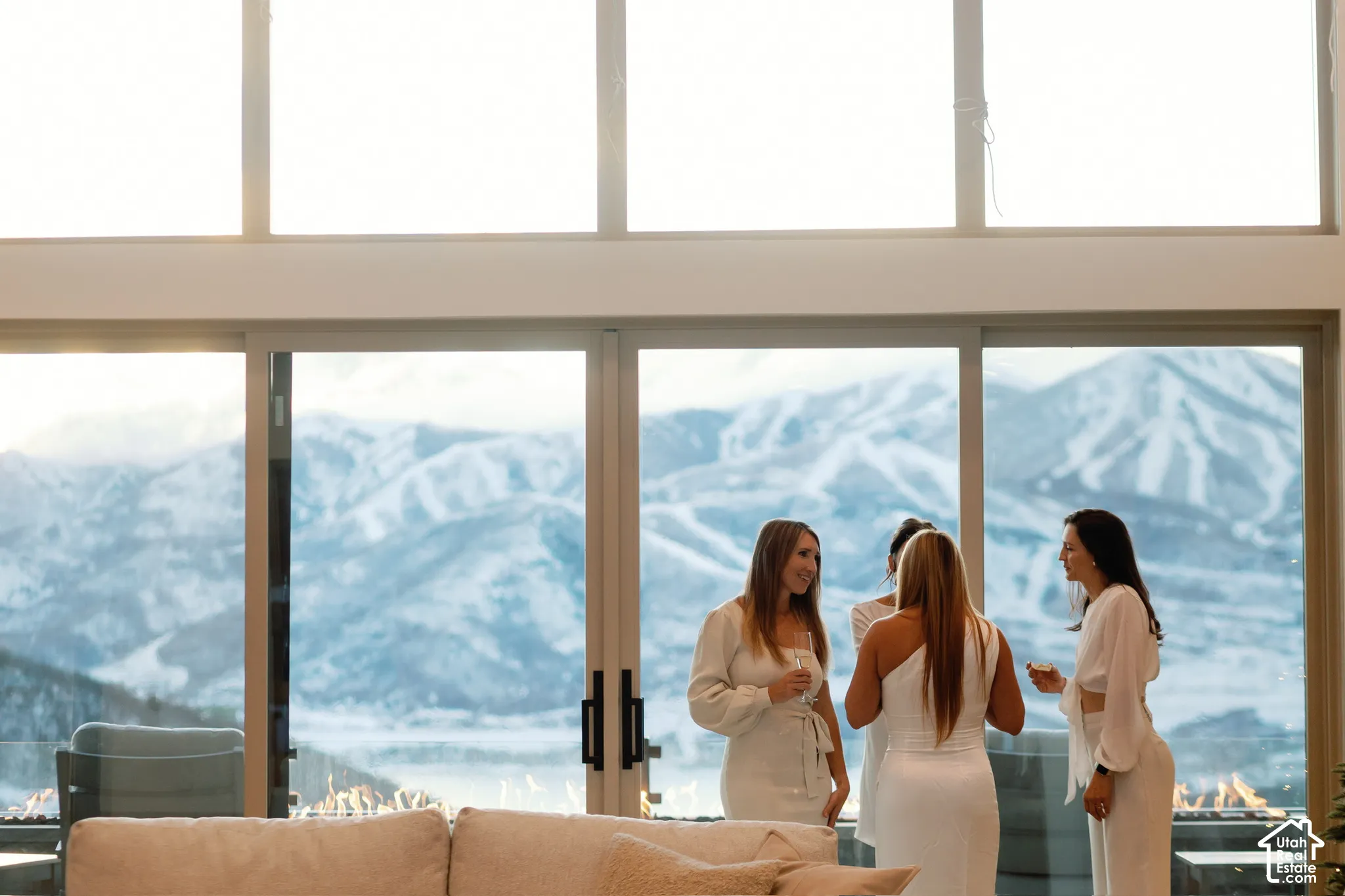 Floor-to-ceiling windows featuring panoramic mountain scenery, expansive glass sliding doors, and high-altitude windows