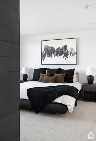 Textured matte black wood-plank accent wall, neutral carpeting, and recessed ceiling lighting