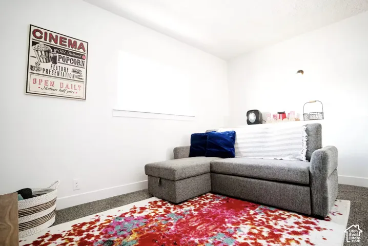 Interior room featuring neutral wall paint, gray carpeting, and a recessed window