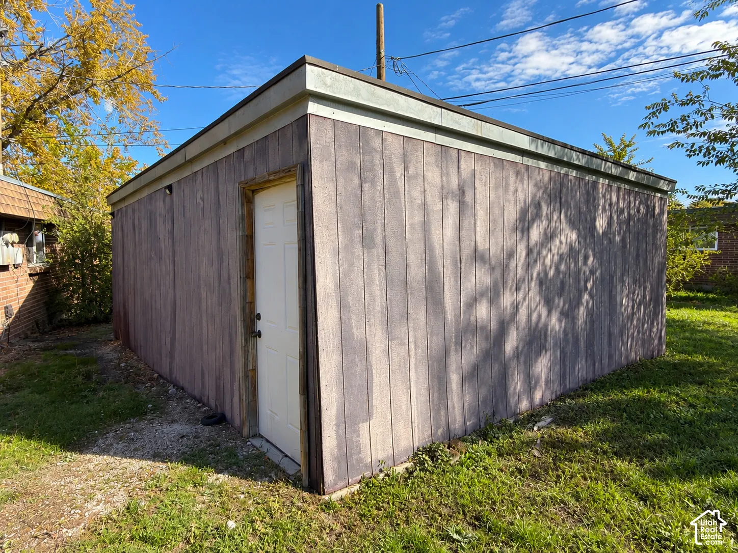 Backside of garage with a storage area