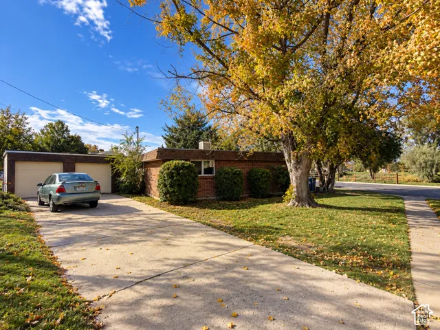North East side of home, showing 2 car garage