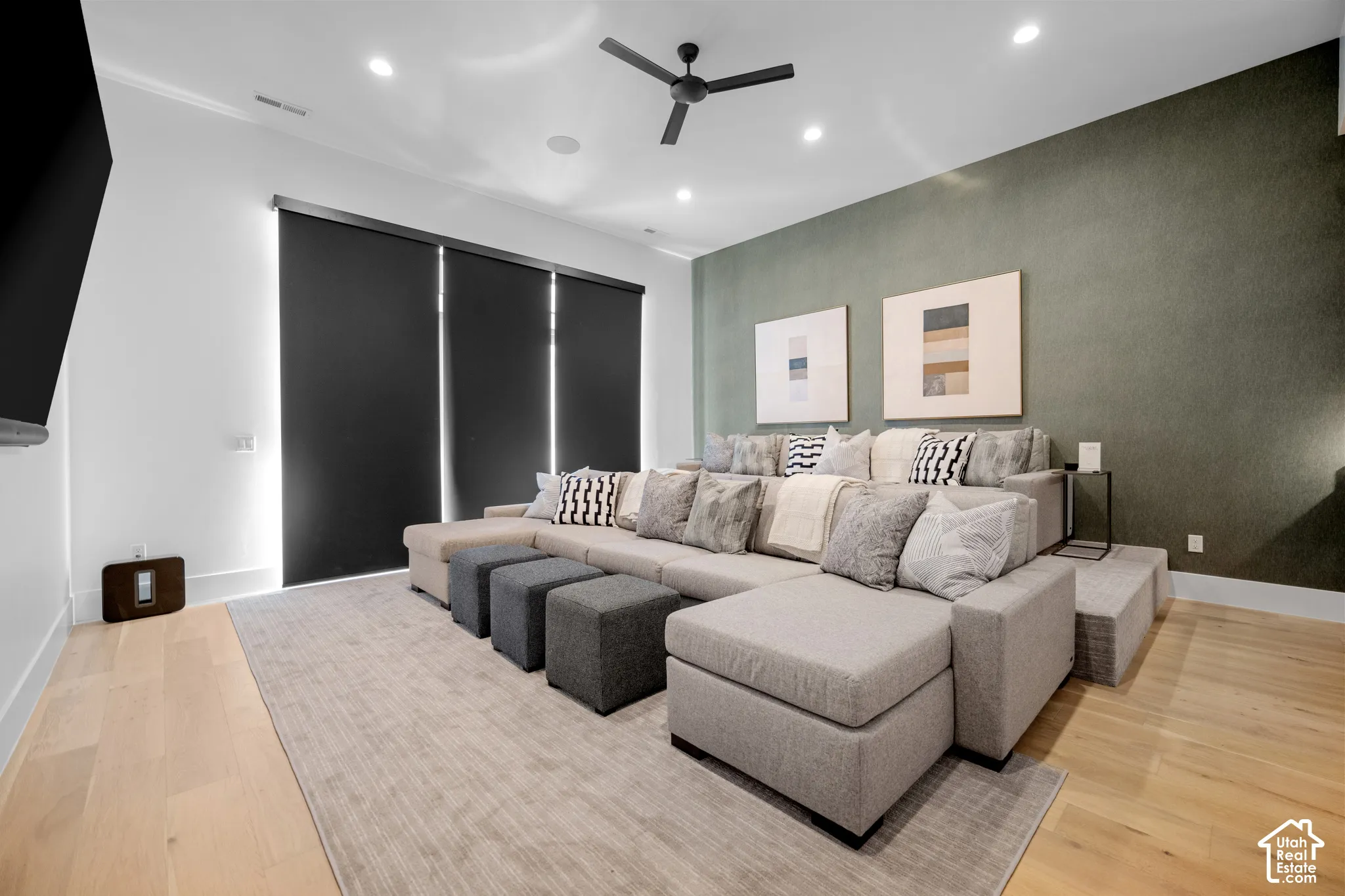 Theater room with motorized blackout shades