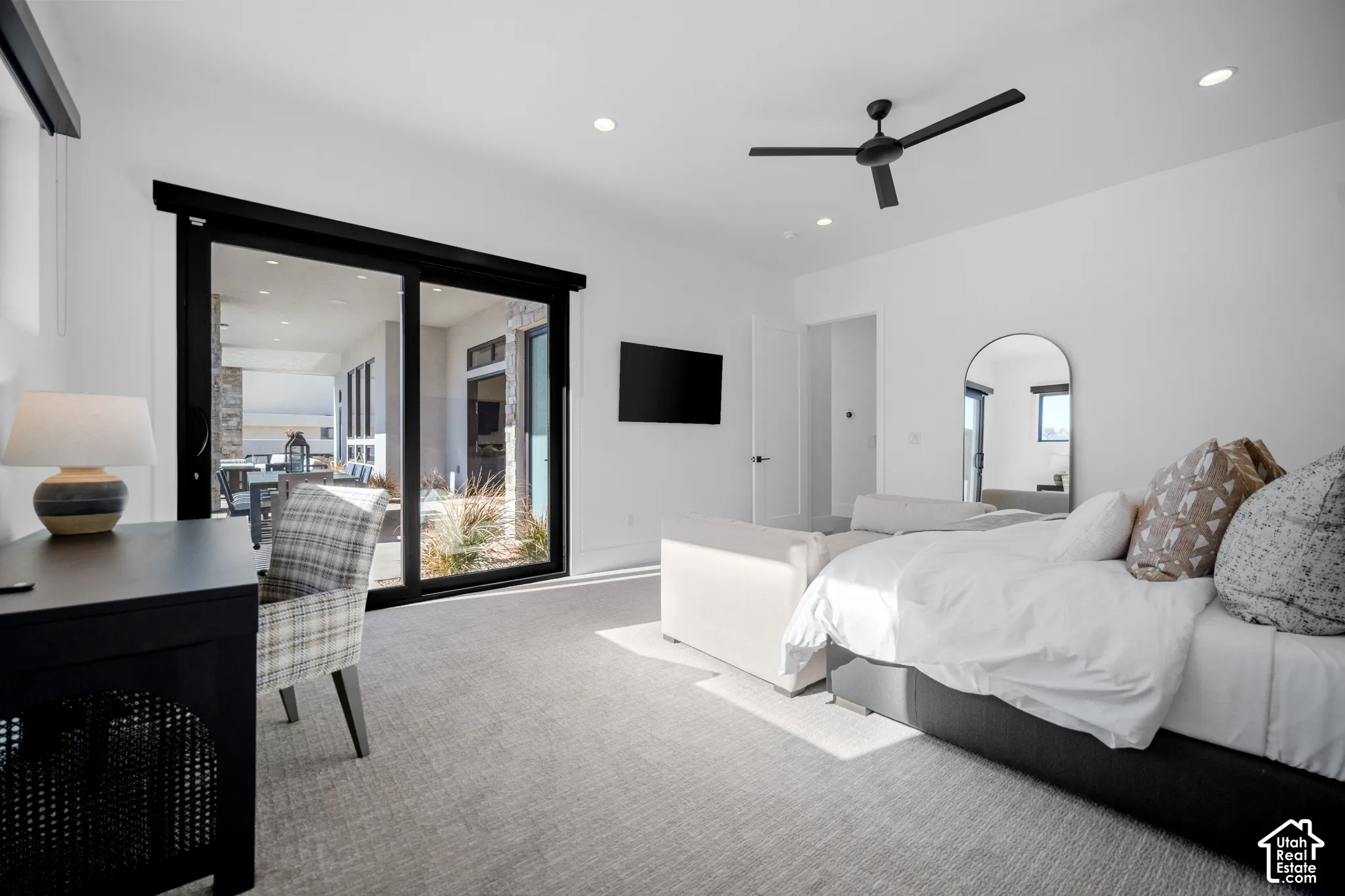 Main primary suite with sliding doors to the covered patio