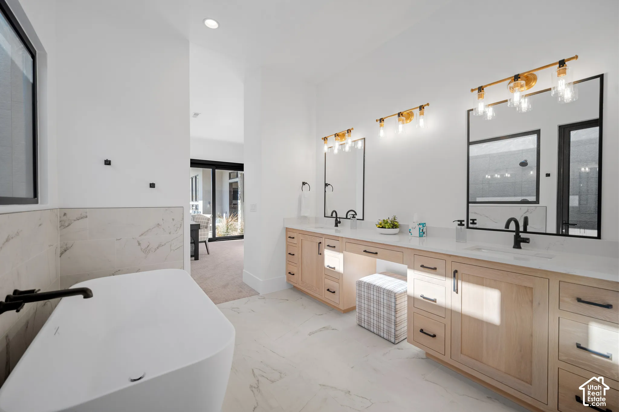 Main primary bath with double vanity and freestanding tub