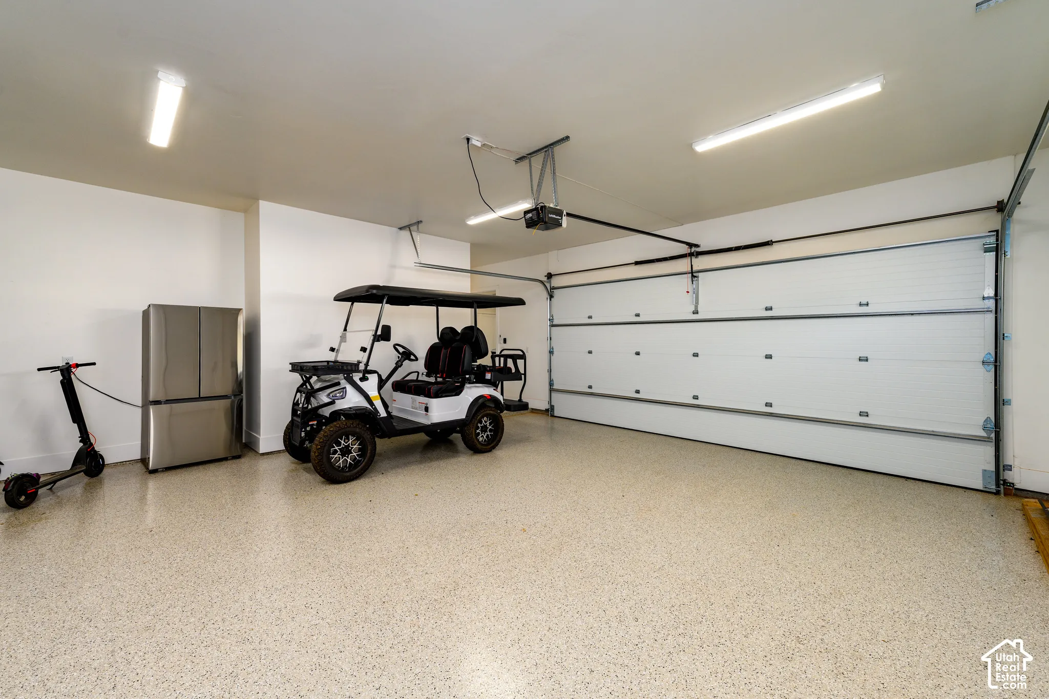 Private owner garage with epoxy floor and room for the golf cart