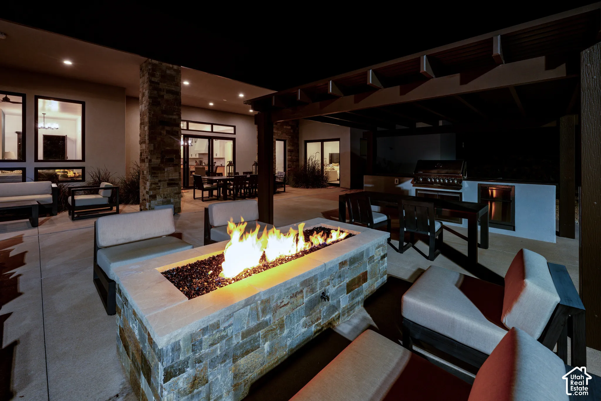 Fire pit and outdoor kitchen under the pergola