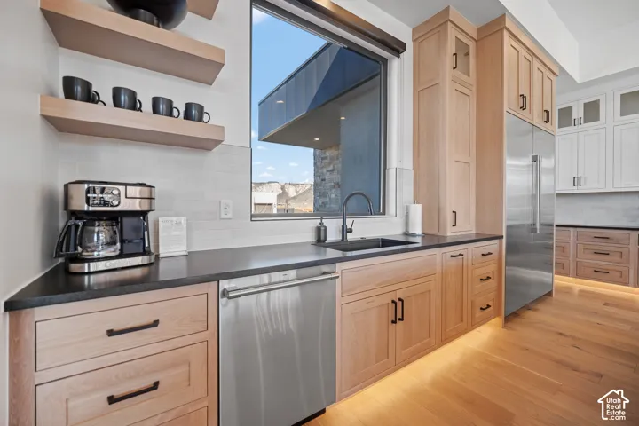 Kitchen sink with window, floating shelves and coffee station
