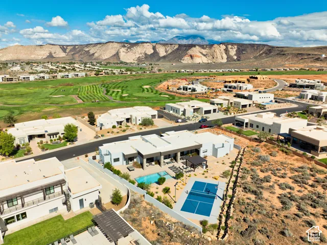 Aerial of the backyard: pool, patio and sport court