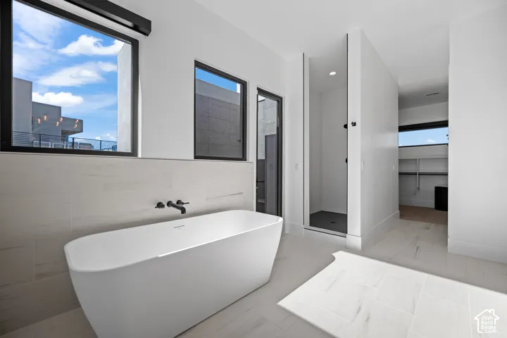 Second primary bath with freestanding tub and indoor shower