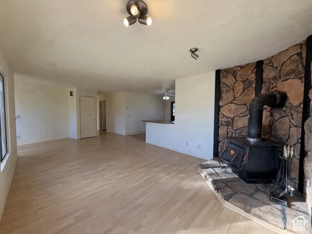 spacious living area with woodstove