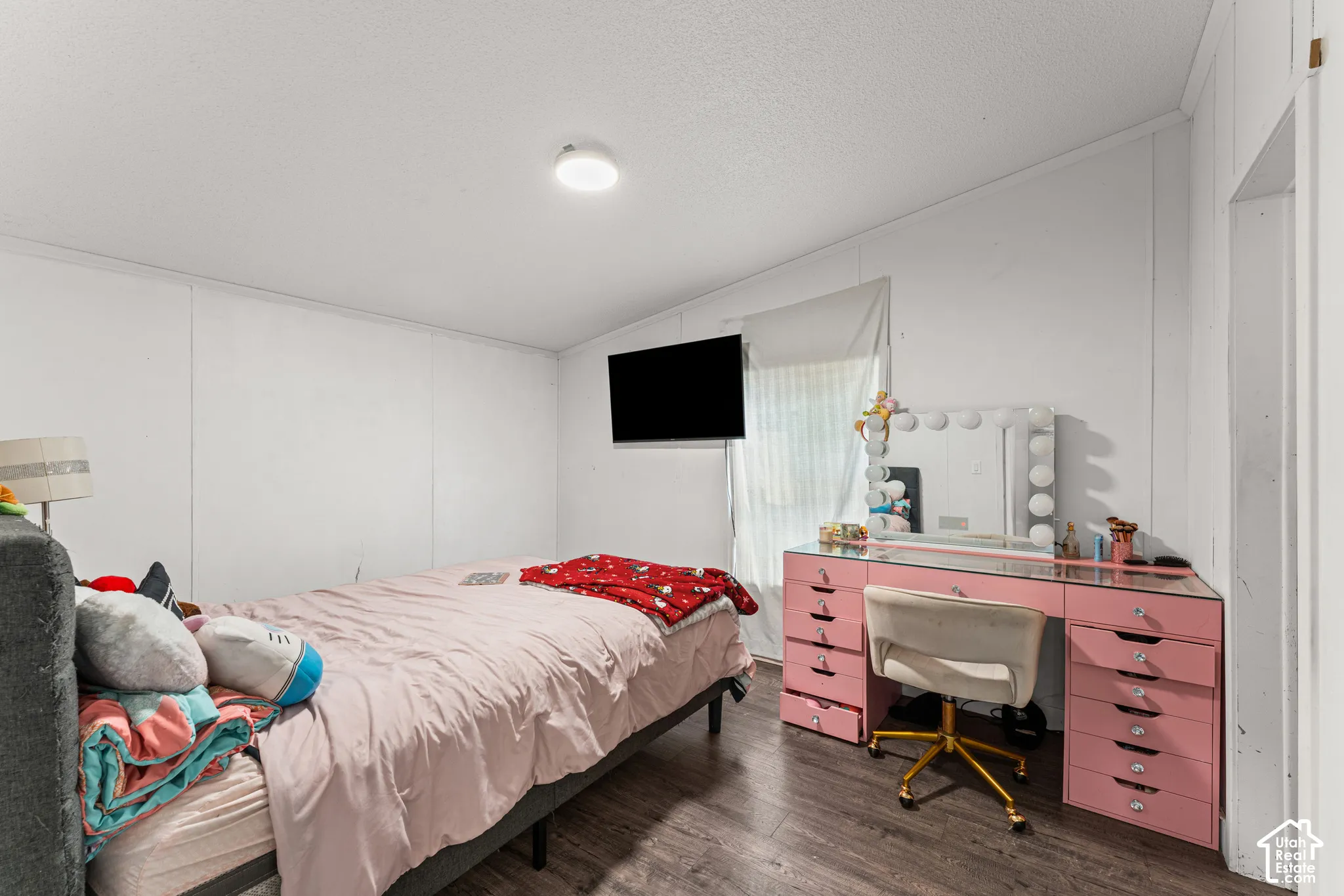 Interior space featuring wood-finish flooring, white walls, and a ceiling-mounted flush light fixture