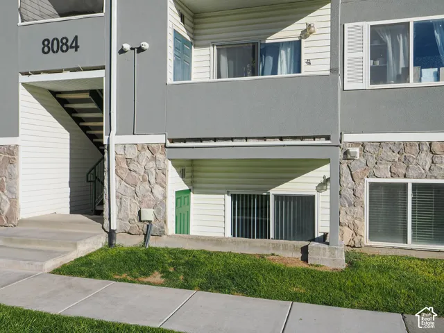 Recessed ground-floor entry with security lighting and private access