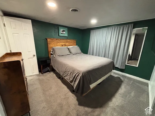 Interior space featuring recessed lighting, wall-to-wall carpeting, and a built-in recessed mirror