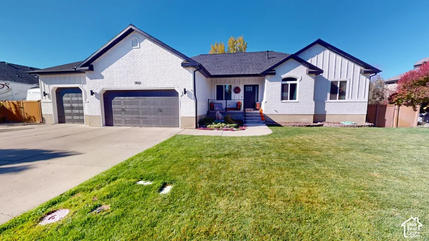Ranch-style exterior featuring a combination of textured masonry and vertical siding, a multi-car garage, an asphalt shingle roof, and a concrete driveway