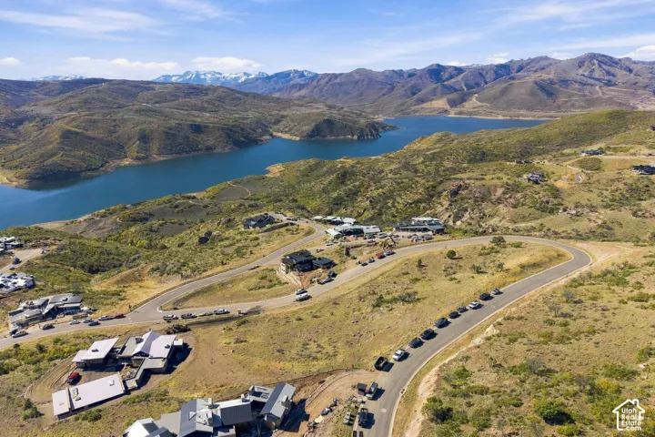 Aerial perspective featuring mountain terrain and proximity to a large reservoir