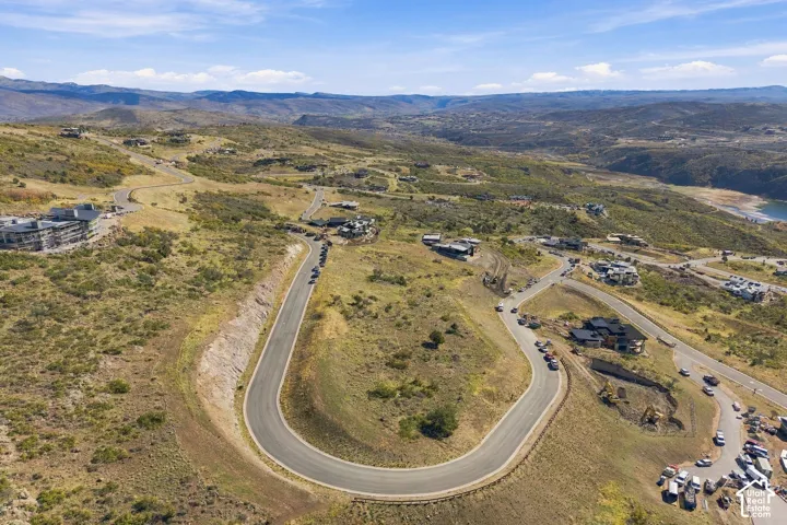 Elevated topography featuring sweeping mountain scenery, expansive natural terrain, and paved winding roads