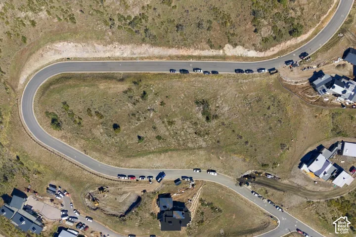 Elevated parcel of land situated on a hillside with paved road access