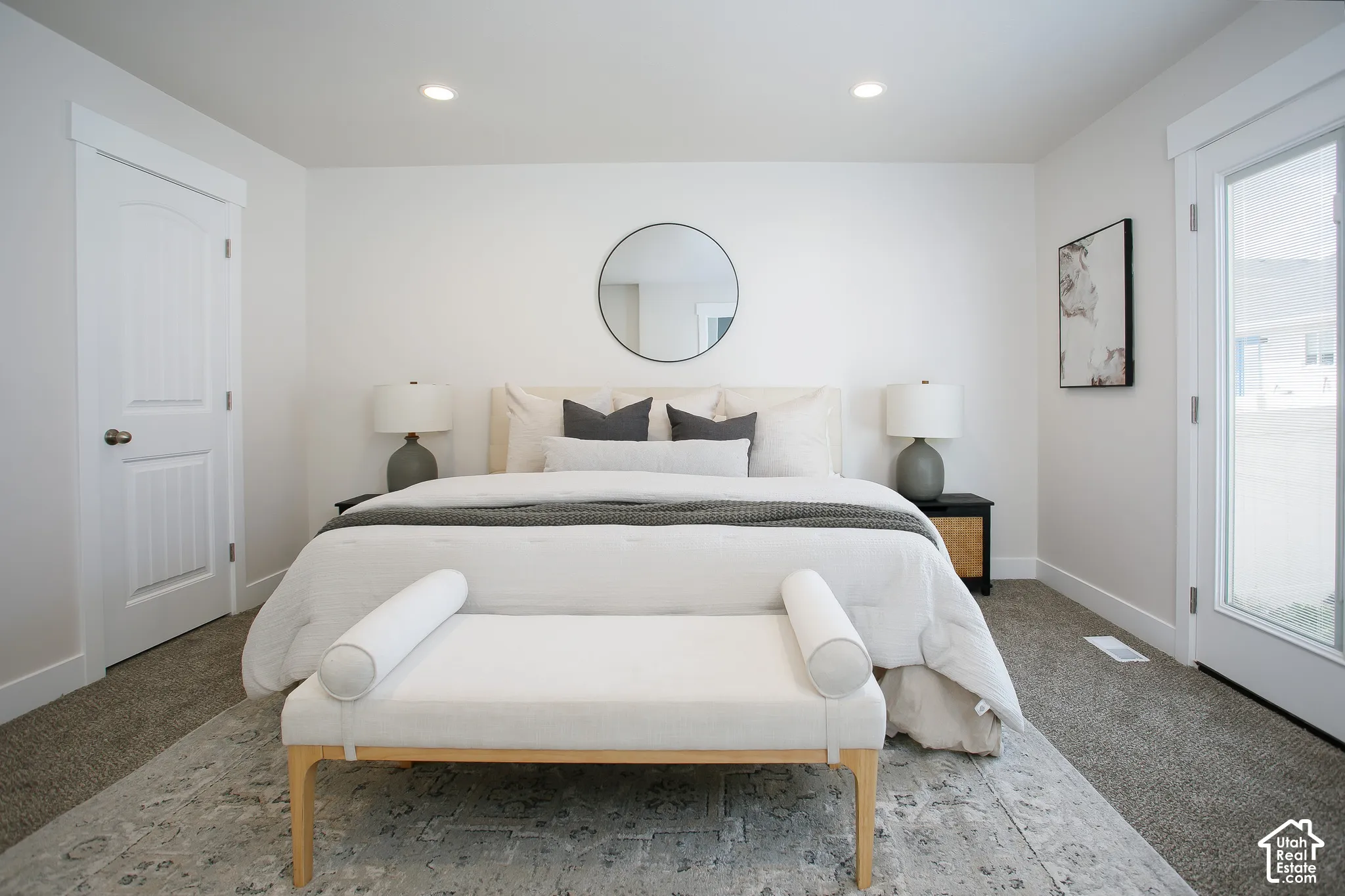Neutral interior featuring recessed lighting, multi-panel doors, and a full-light glass panel exterior door