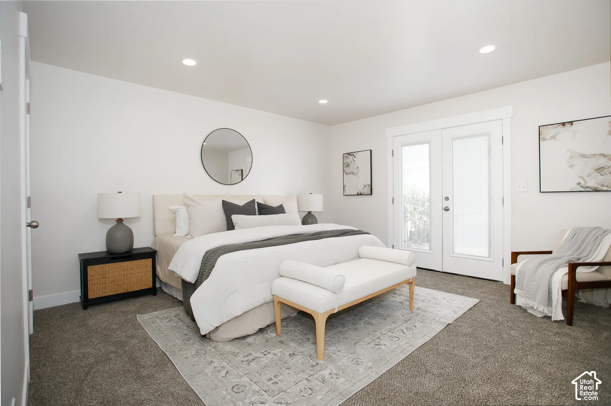 Neutral interior space featuring high-pile wall-to-wall carpeting, recessed ceiling lighting, and double glass-paned doors with exterior access