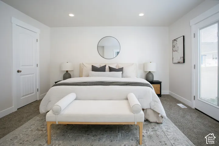 Neutral interior featuring recessed lighting, multi-panel doors, and a full-light glass panel exterior door
