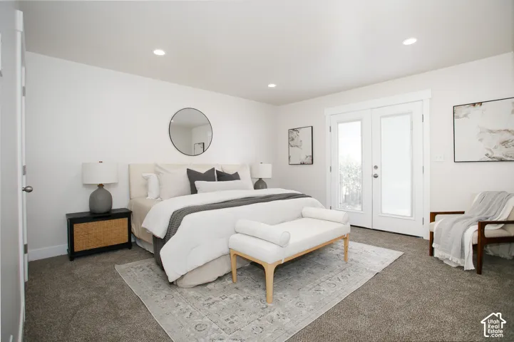 Neutral interior space featuring high-pile wall-to-wall carpeting, recessed ceiling lighting, and double glass-paned doors with exterior access