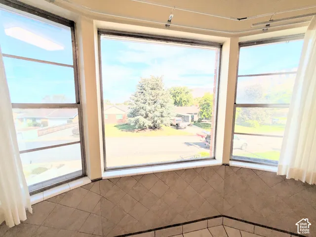 Bay window featuring expansive, multi-pane windows and tile flooring laid in a diamond pattern