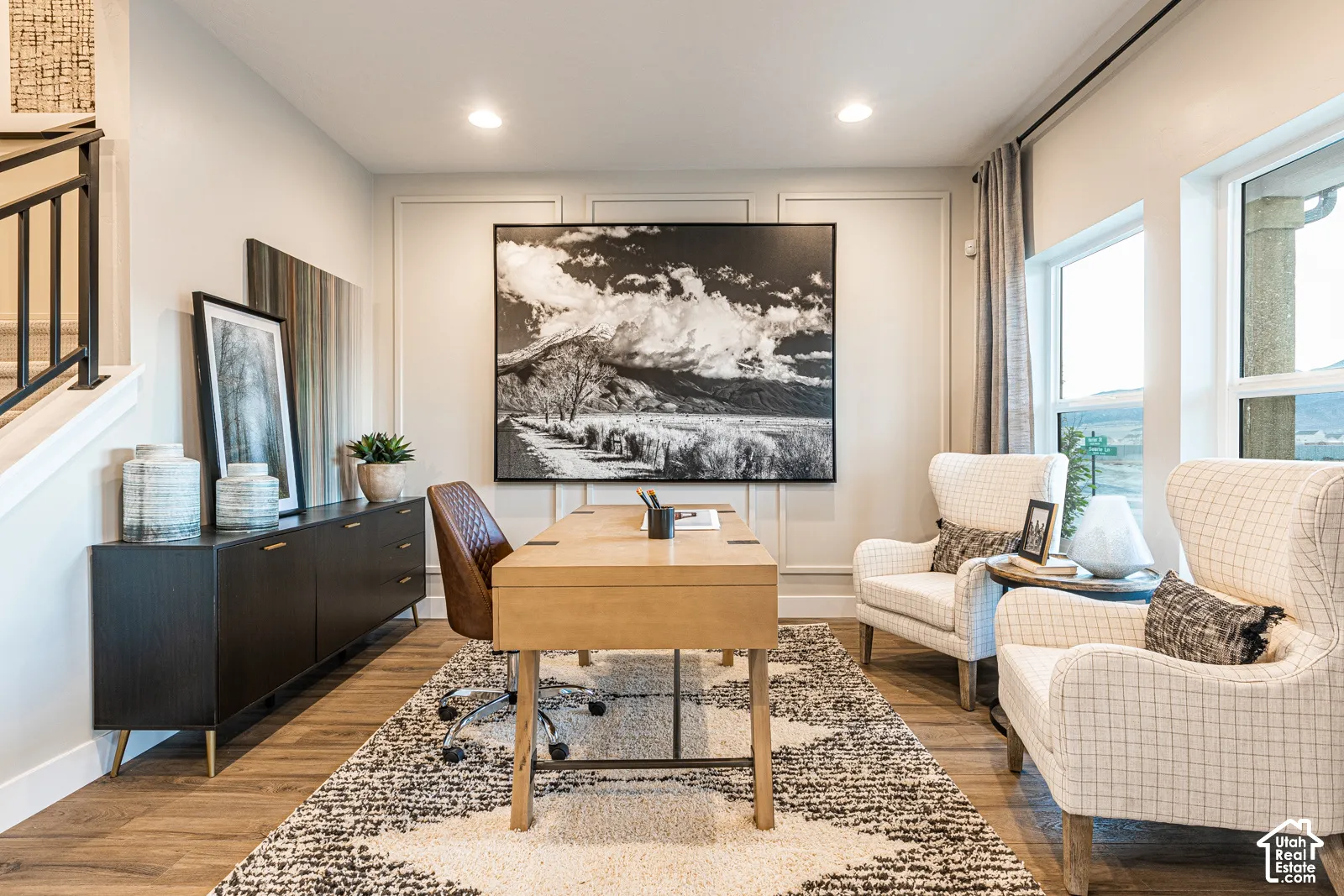 Room featuring wall molding, wood-finish flooring, and recessed ceiling lighting