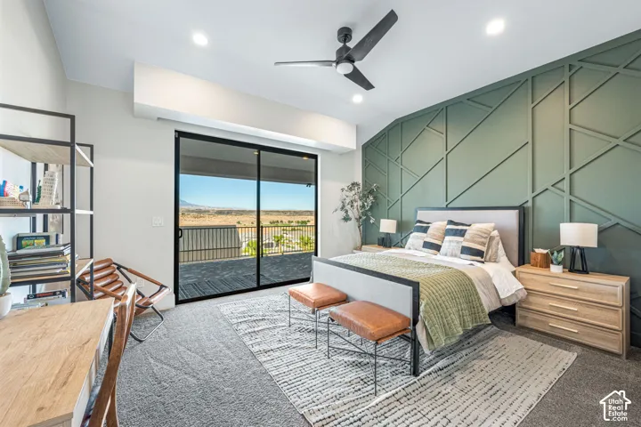 Green geometric wall paneling, sliding glass doors, matte black ceiling fan, recessed lighting, and carpeted flooring