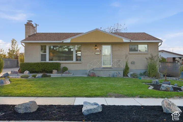 Brick rambler with mature landscaping