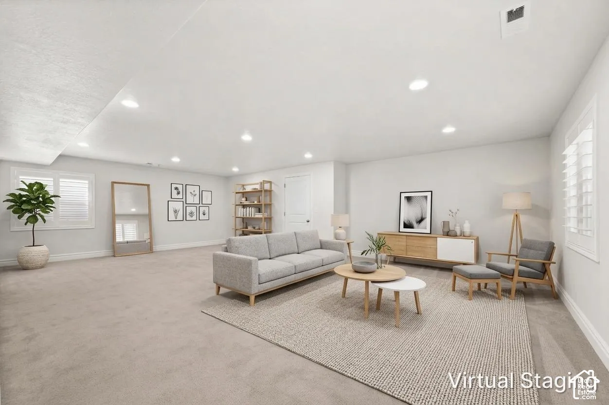 Neutral-toned wall-to-wall carpeting, recessed ceiling lighting, and plantation shutter window treatments