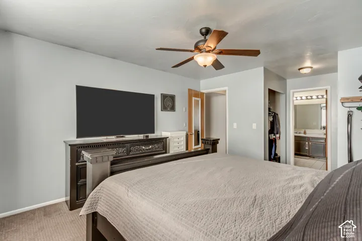 Room featuring a ceiling fan with integrated lighting, neutral wall paint, and wall-to-wall carpeting